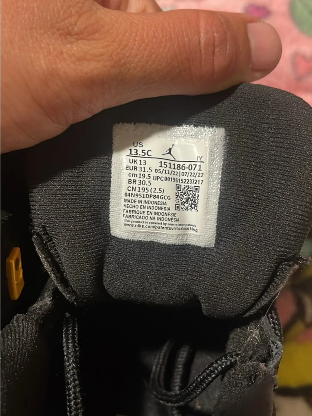 Jordan Black and Gold Logo High-Top Sneakers